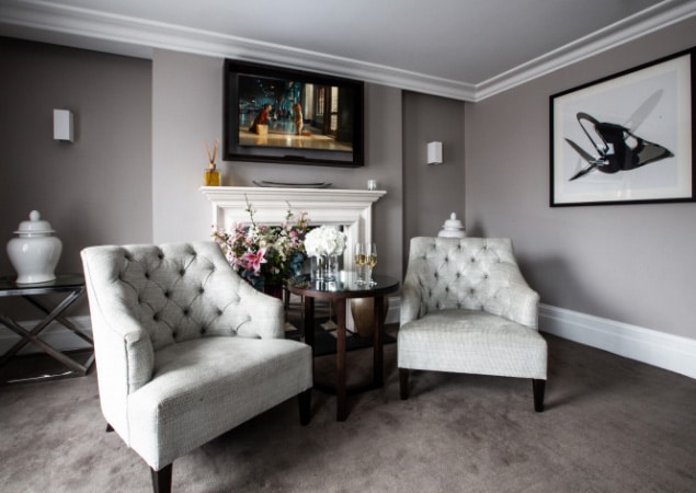 Bedroom with Two Armchairs at One Warwick Park