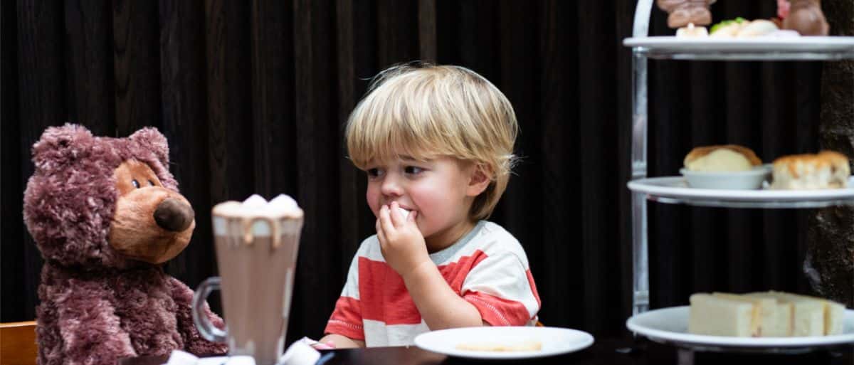 child with tea