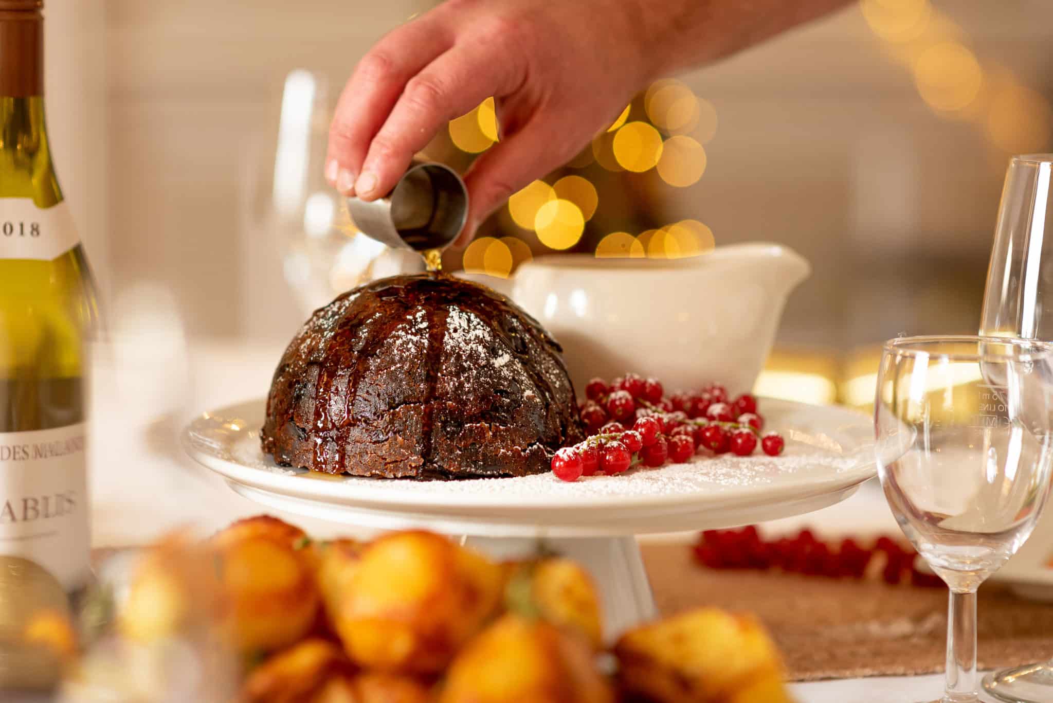 christmas pudding with wine and nibbles