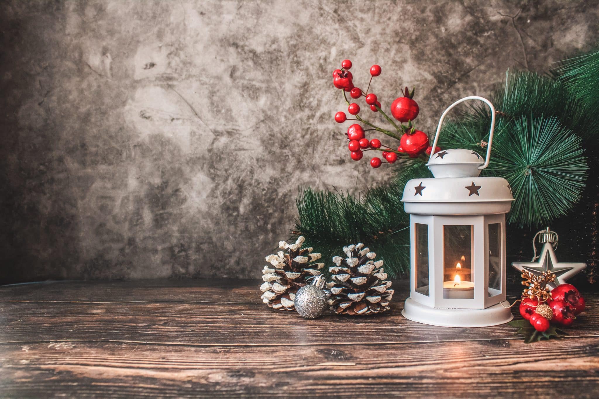 christmas decorations around a candle