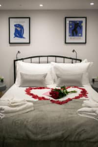 Bed with roses in the shape of a heart