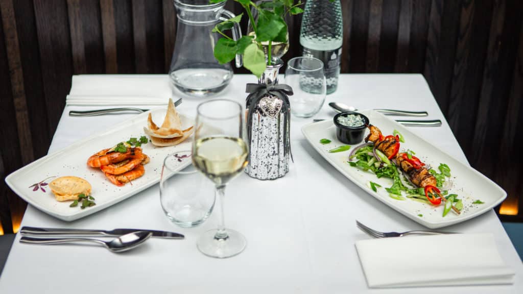 Table set with two decorated dishes