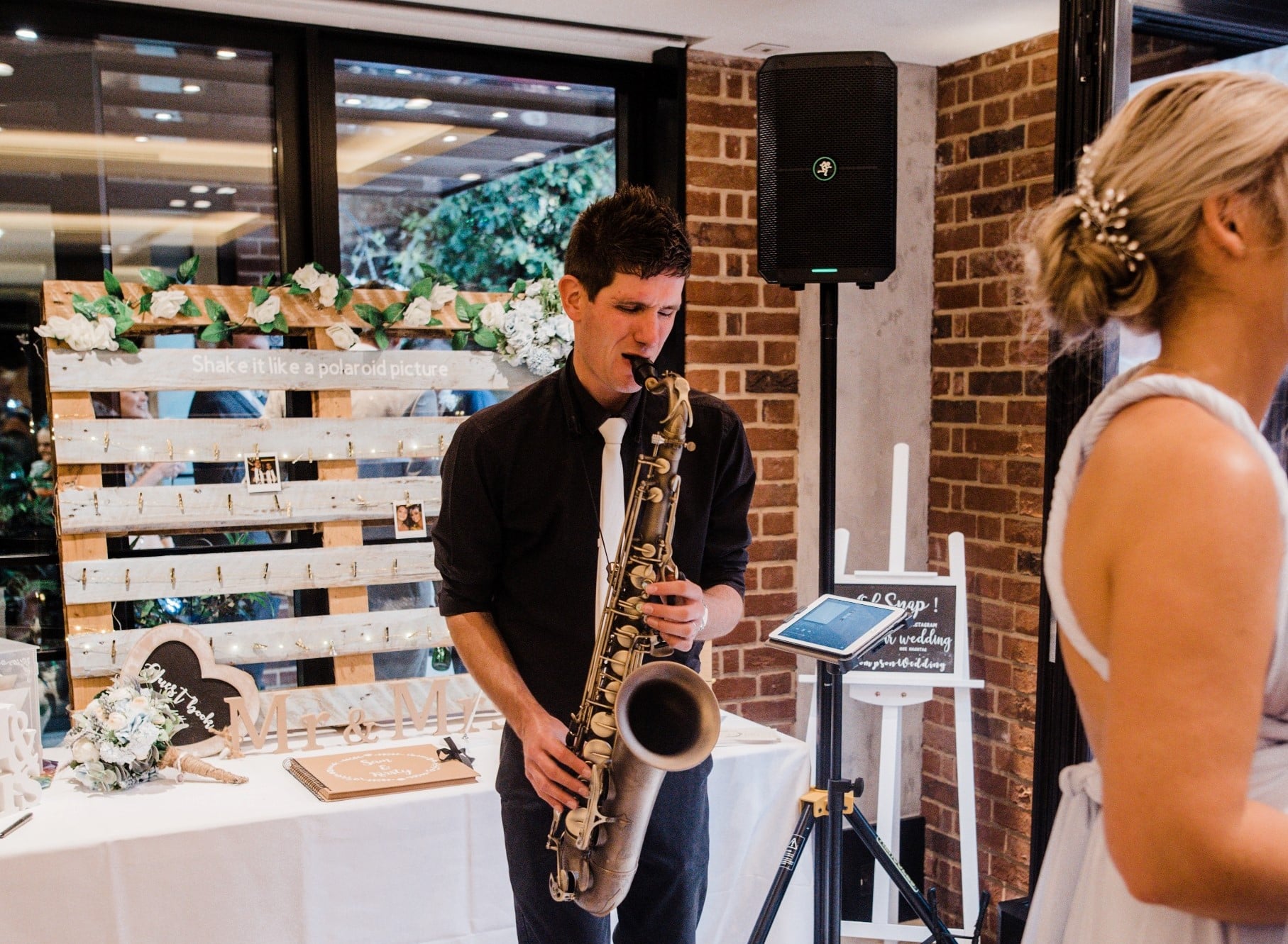 saxophonist performing at wedding reception