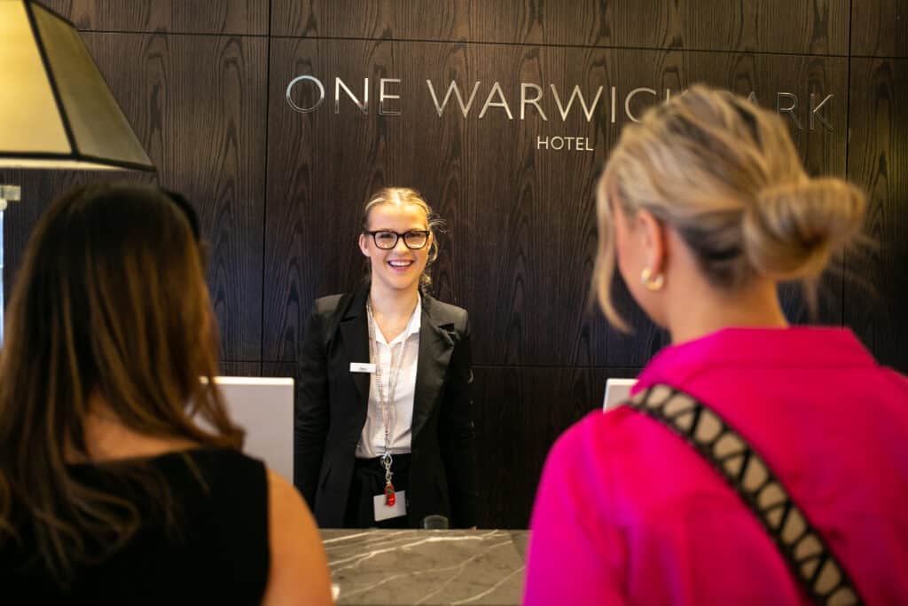 Two business women checking in at a luxury hotel in Tunbridge Wells