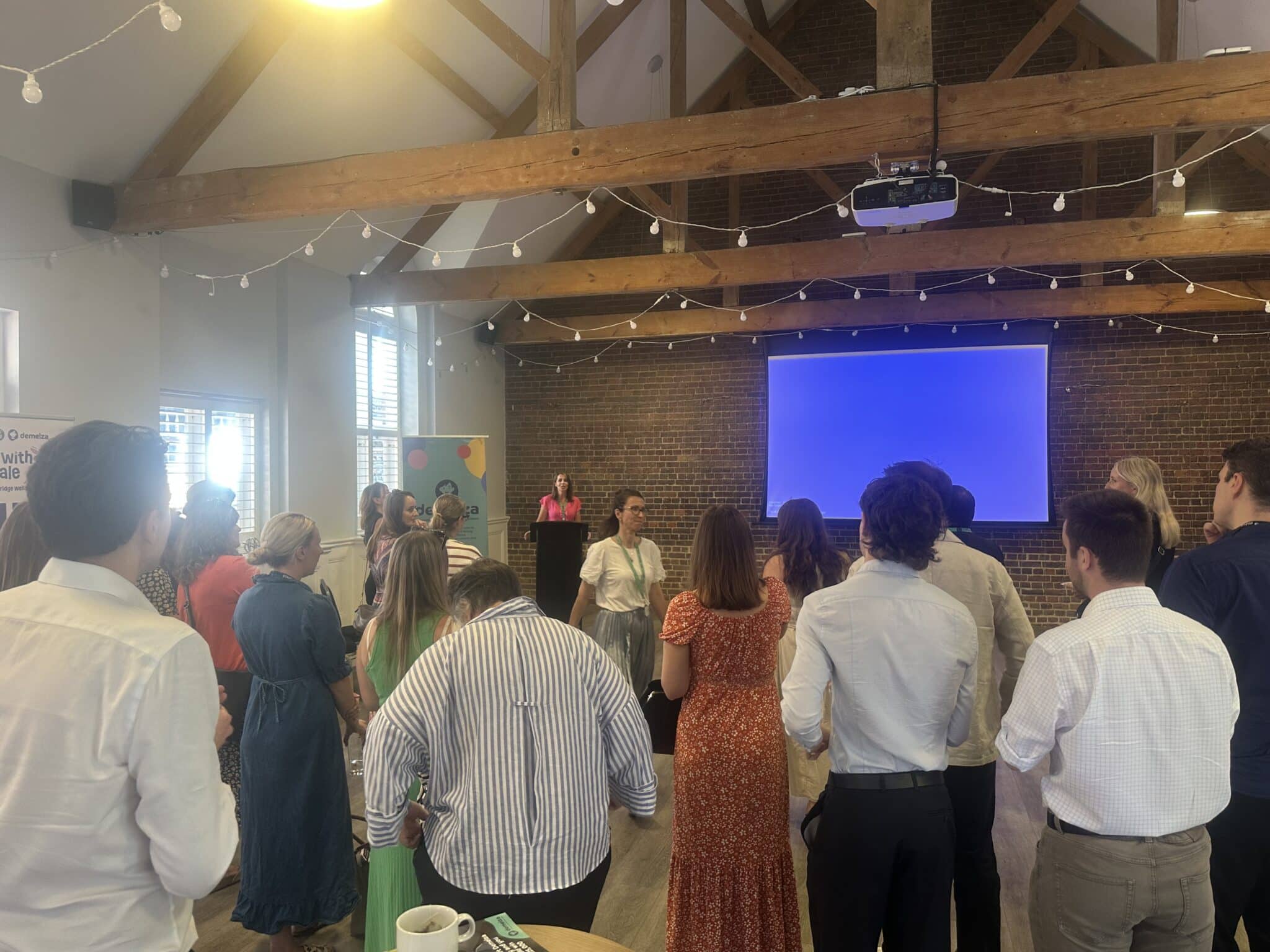 A group of people attending a talk at One Warwick Park