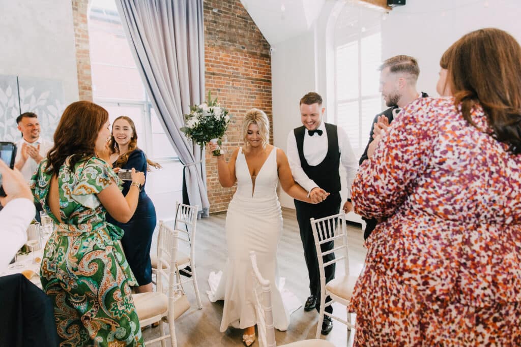 Bride and Groom entering the function room at One Warwick Park