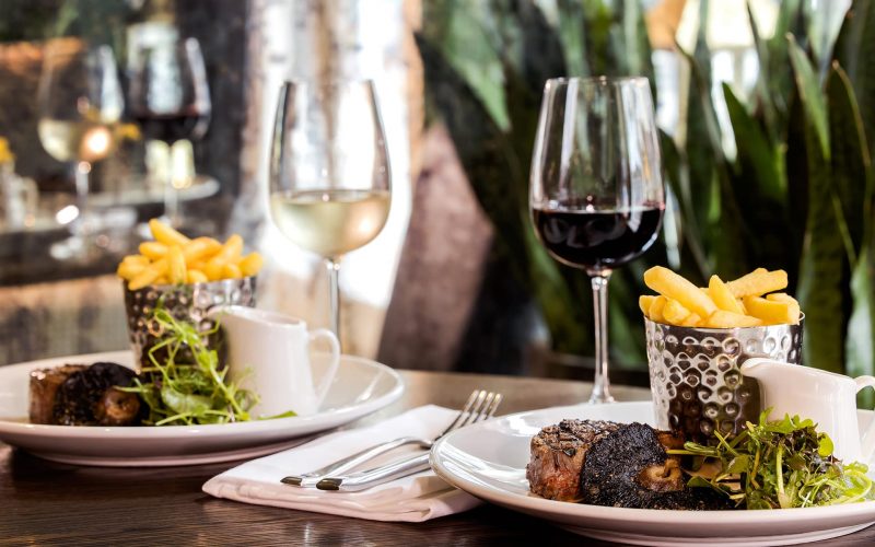 Two steaks and wine served at a restaurant in Tunbridge Wells
